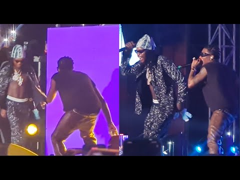 Shocker! Naira Marley Steals The Show As He Surprises Wizkid On Stage At His Show